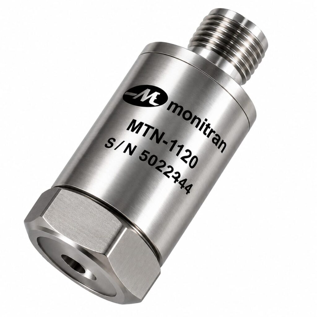 Acelerómetro industrial compacto de propósito general con carcasa de acero inoxidable y conector TNC superior para monitorización de vibraciones.